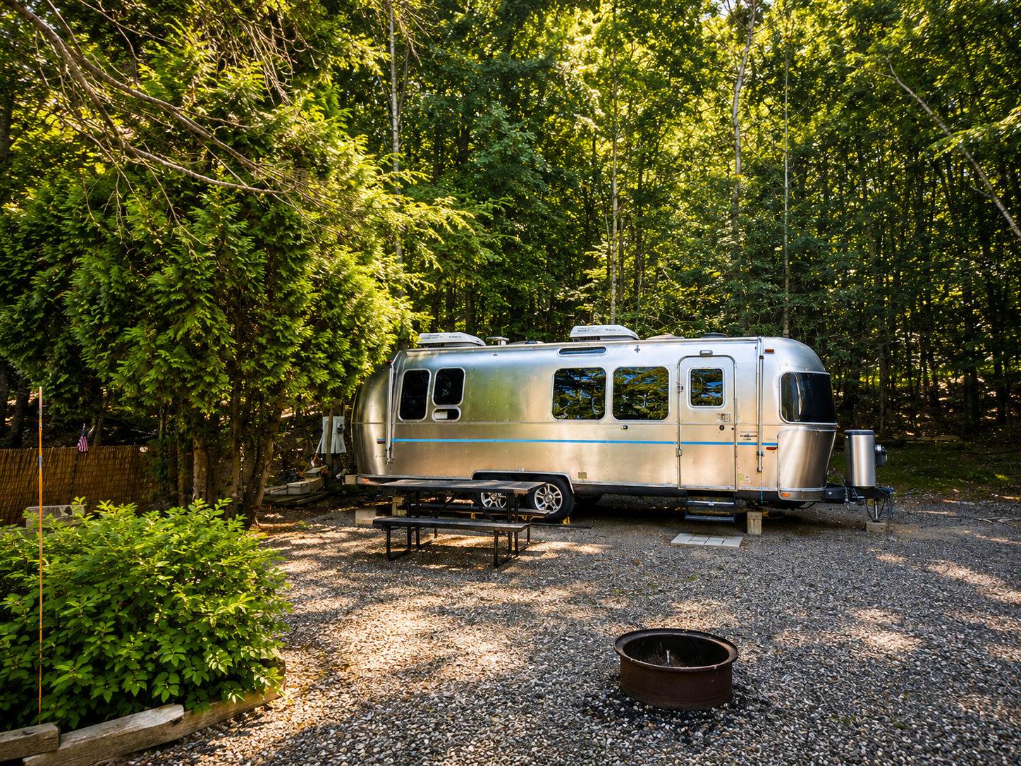 Airstream rental on a spacious wooded campsite at Pioneer Valley