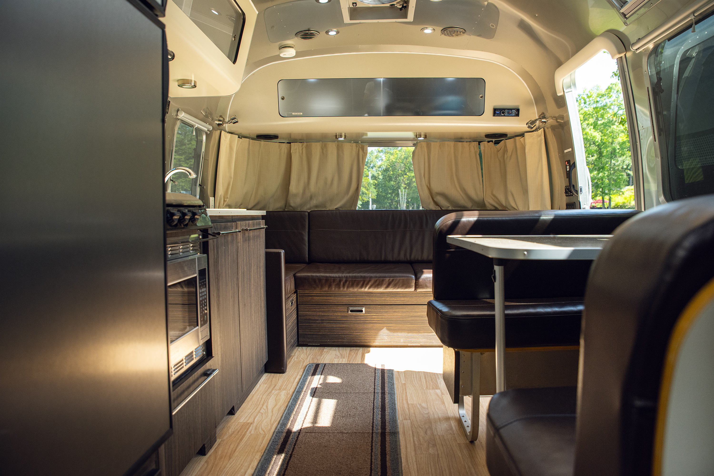 Lounge and dining area inside the Pioneer Valley Airstream rental